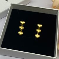 Balenciaga Three Heart Earrings In Gold