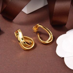 Balenciaga Force J Shaped Earrings In Gold