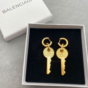 Balenciaga Key Stud Earrings In Gold